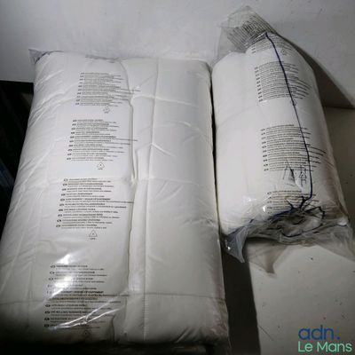 two pillows that have been wrapped up on a table