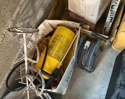 a box full of tools that are sitting on the floor
