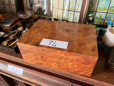 a wooden box with a number on it sitting on a table