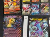 a lot of pokemon cards that are on the table