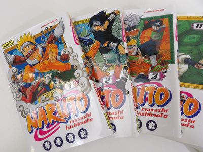 three packs of naruto trading cards on a white surface
