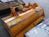 a picture of a snow plow sitting on the ground