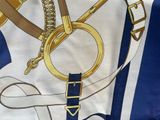 an image of a scarf with a gold ring on it