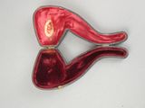 a red hat and a pipe in a red case