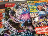 a lot of pokemon comics on the table