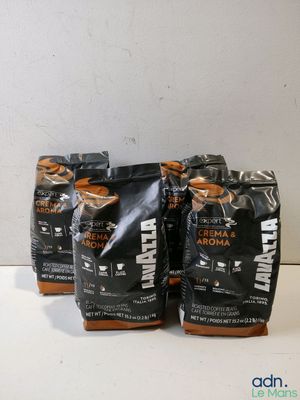 three bags of coffee sitting on top of a white table