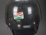 a helmet with a sticker on it that says budi port