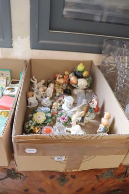 two boxes full of toys sitting on the floor