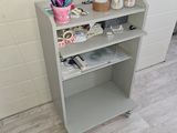 a shelf that has various items on top of it
