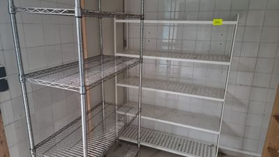 a metal shelving in the corner of a room