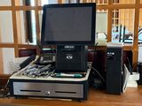 an image of a desk with a monitor and other electronics