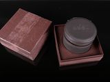 a brown box with a black lid and a brown lid