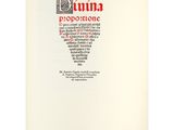 a white book with a black and red design on it