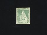 the stamp is green and has a picture of a man on a horse