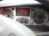 a close up of a car dashboard with a clock on it