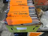 boxes of cds are stacked on top of each other in a warehouse