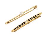 a close up of a pair of hair pins on a white background
