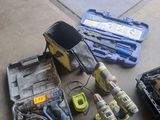 a lot of tools that are sitting on the floor