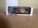 a toy car that is in a box on a table
