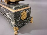 a statue of a man riding a horse on top of a box
