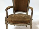 an old chair with a brown upholstered seat on a white background