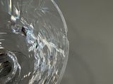 a close up of a glass bowl with a hole in it