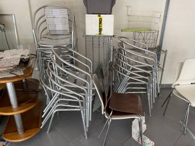 many chairs and tables in a room with a parking meter