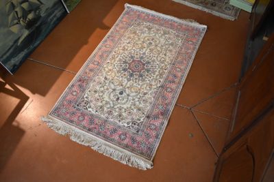 two rugs that are on the floor in a room