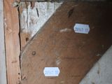 a close up of a piece of wood with a tag on it