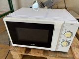 a microwave that is sitting on a pallet