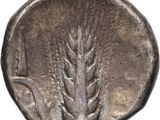 a close up of a silver coin with a bird on it