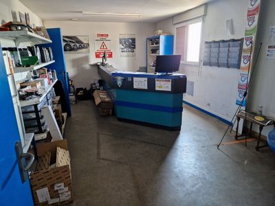 an image of a garage with a lot of items on the shelves