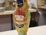 a figurine of a bird on a table in a room