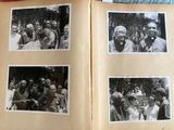 several black and white photos of a group of people in an open book