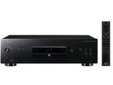 a close up of a cd player with a remote on a white background