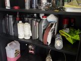 a black cabinet with many bottles and containers on it