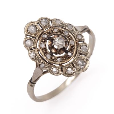 an image of a silver ring with a diamond center