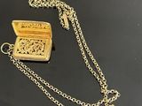 gold plated necklace with a small wooden box on a chain