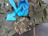 many different types of military clothing laid out on the ground
