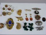 many different types of jewelry on a white surface