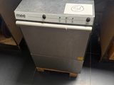 a silver dishwasher sitting on a counter in a kitchen