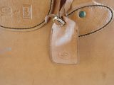 a brown bag with a tag on it