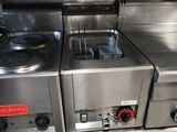 stainless steel kitchen appliances are lined up in a row