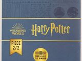 the wizard ' s world of harry potter book with a gold medal