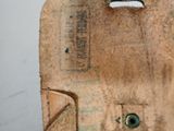 a small wooden object with a hole in it