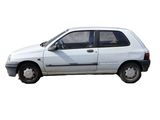 a white car that is parked on the side of the road