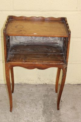 a small wooden table with a shelf on top of it