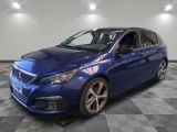 a blue car is parked in a room with a checkered floor