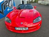 a red sports car parked in front of a building