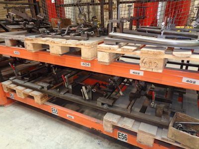many different types of tools on the shelves in the warehouse